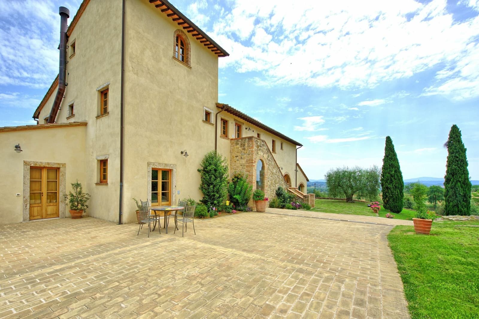 Tenuta La Barricaia — the stone villa and its paved courtyard