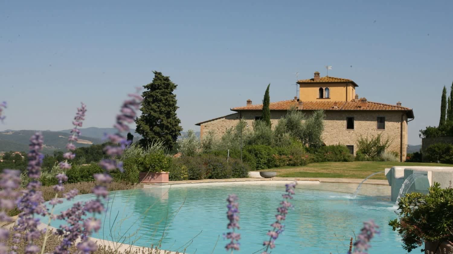 Solare del Chianti — the pool with the farmhouse beyond