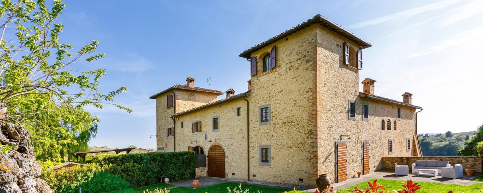 Podere Pianoro — the stone villa and its tower
