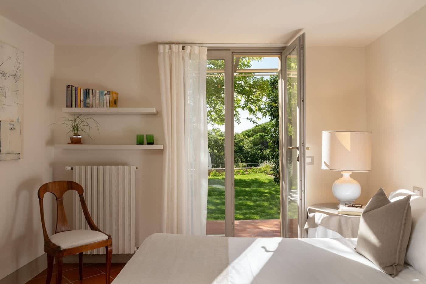 Casa Lilia — a bedroom opening onto the garden