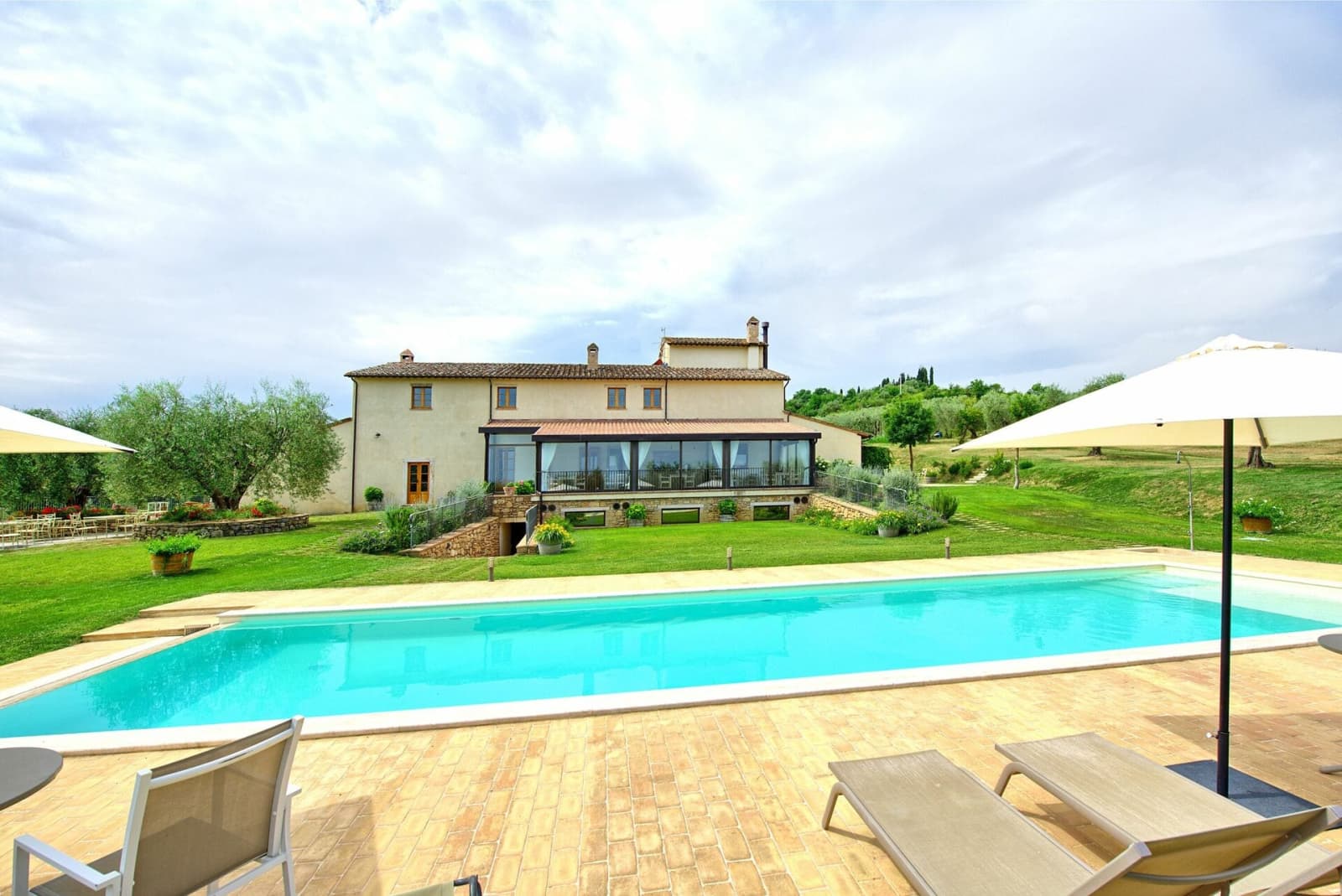 Tenuta La Barricaia — the pool terrace with the villa beyond