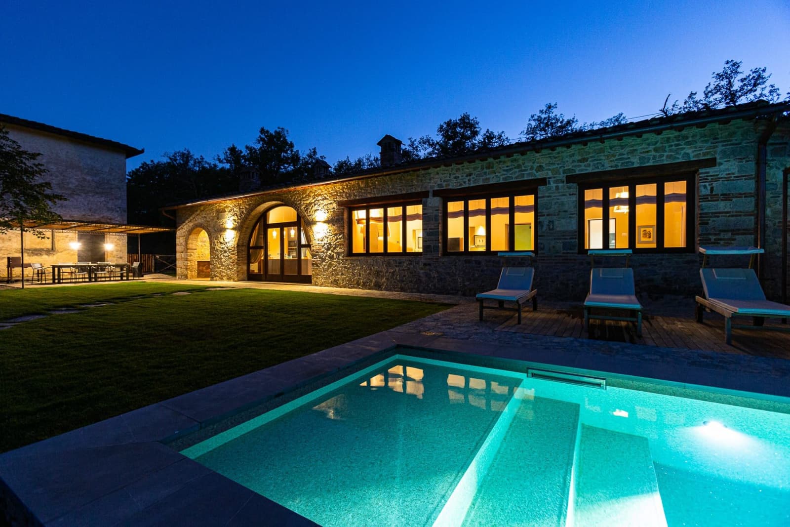 Casa Faraonia — the pool lit at dusk