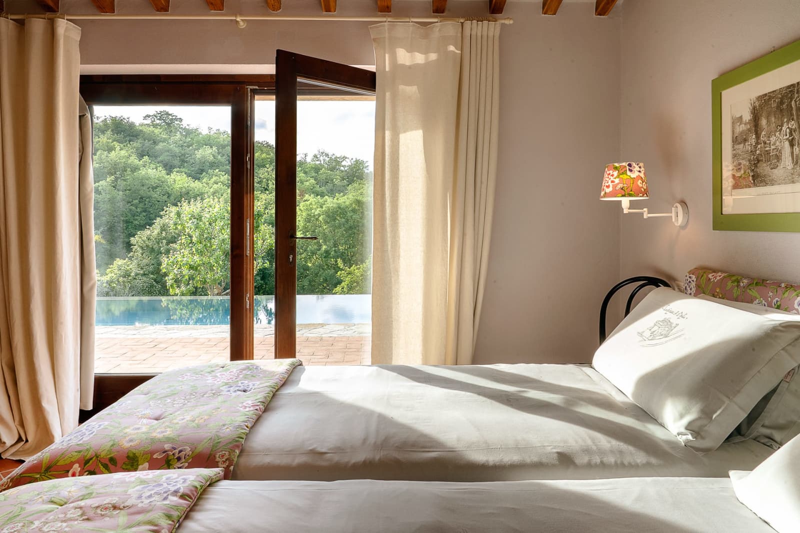Casa Pernicella — a bedroom looking out to the pool