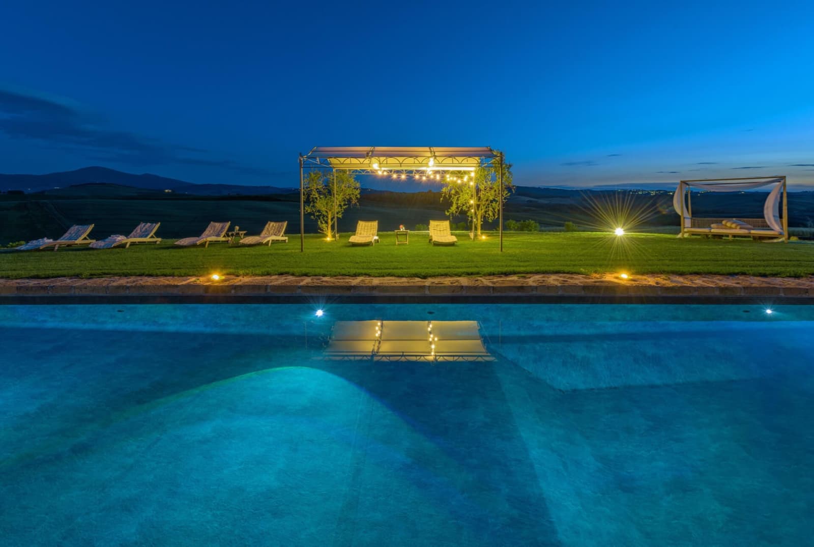 Villa delle Sorelle — the pool lit at night