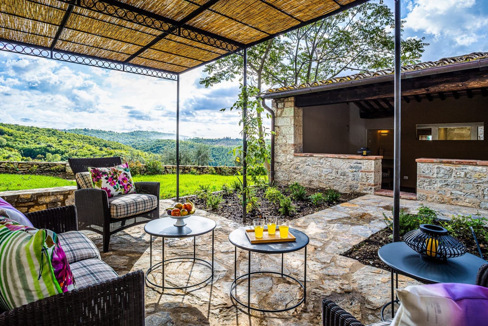 Casa dell'Erta — pergola seating over the countryside