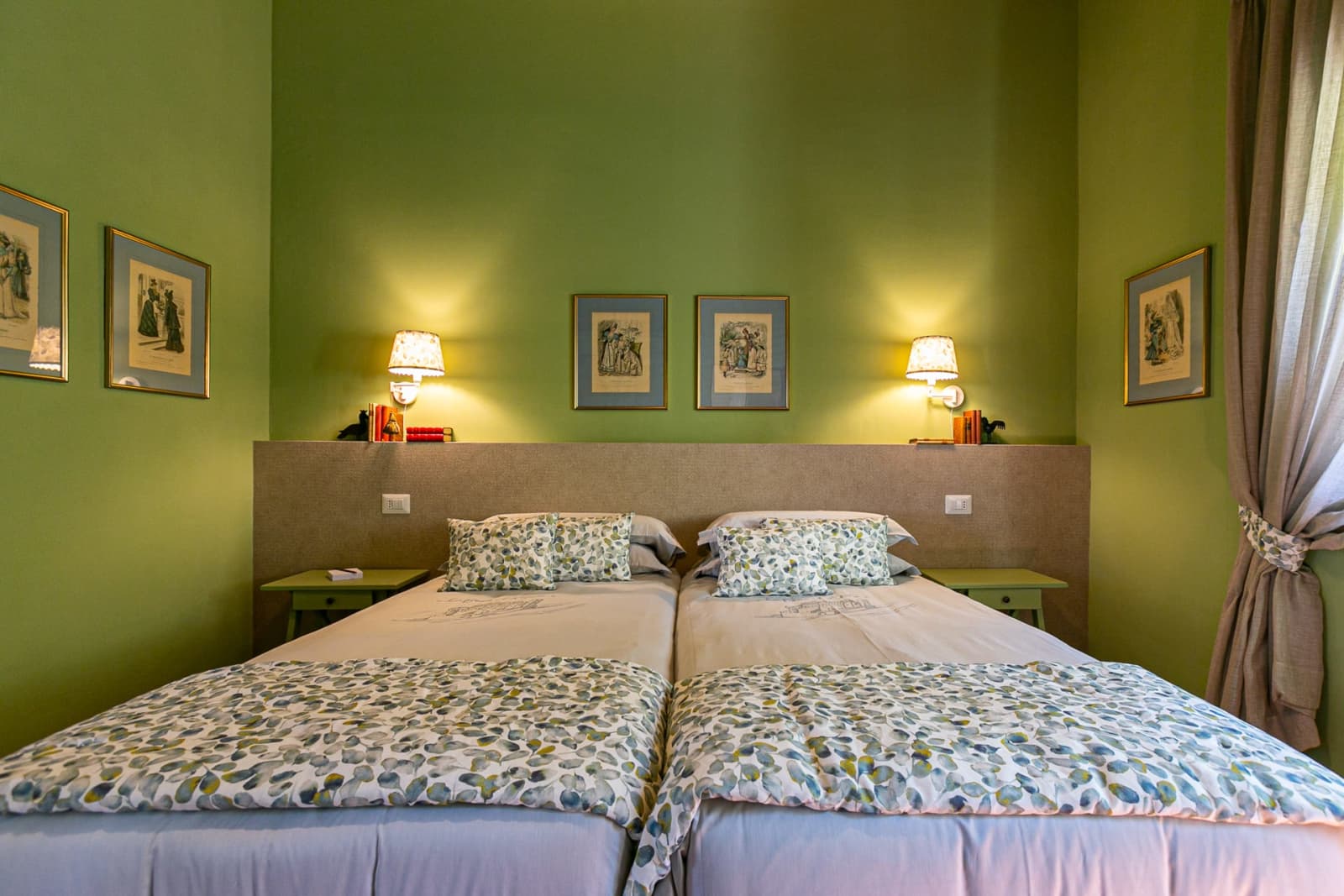 Casa Faraonia — a twin bedroom with sage walls