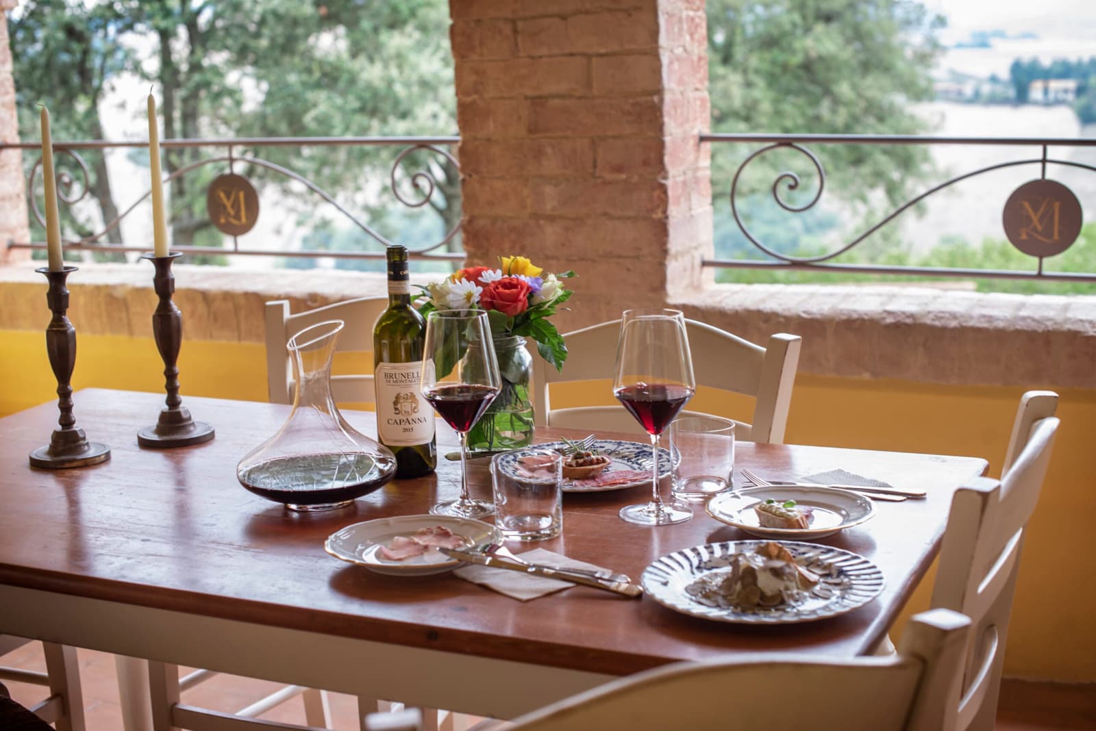 Villa Poggio d'Oro — a table laid for dinner by the window