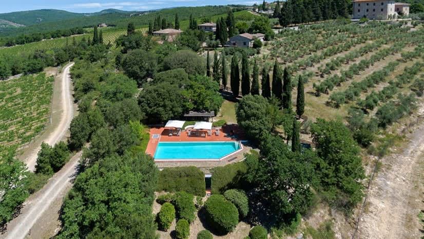 Borgo delle Vigne — an aerial view over the estate, pool and surrounding vineyards