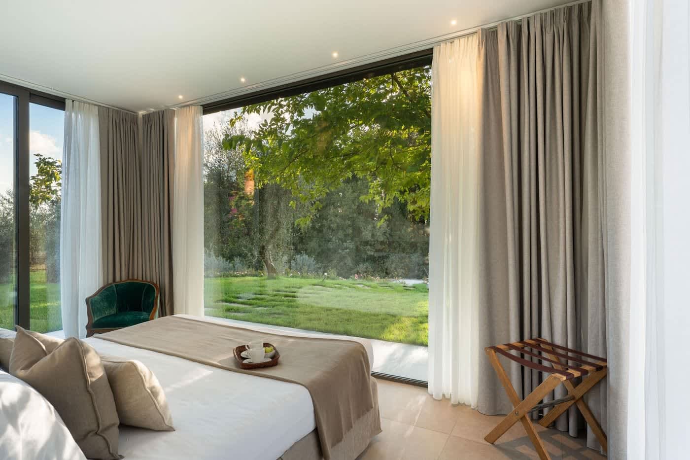 Casa Lilia — a bedroom looking out to the trees
