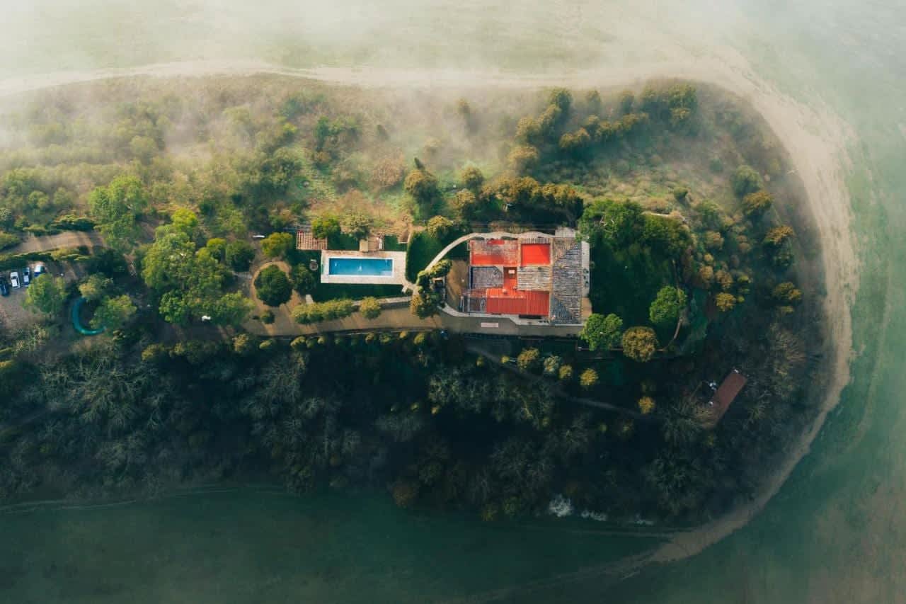 Villa Poggio d'Oro — the hilltop above morning mist, from the air