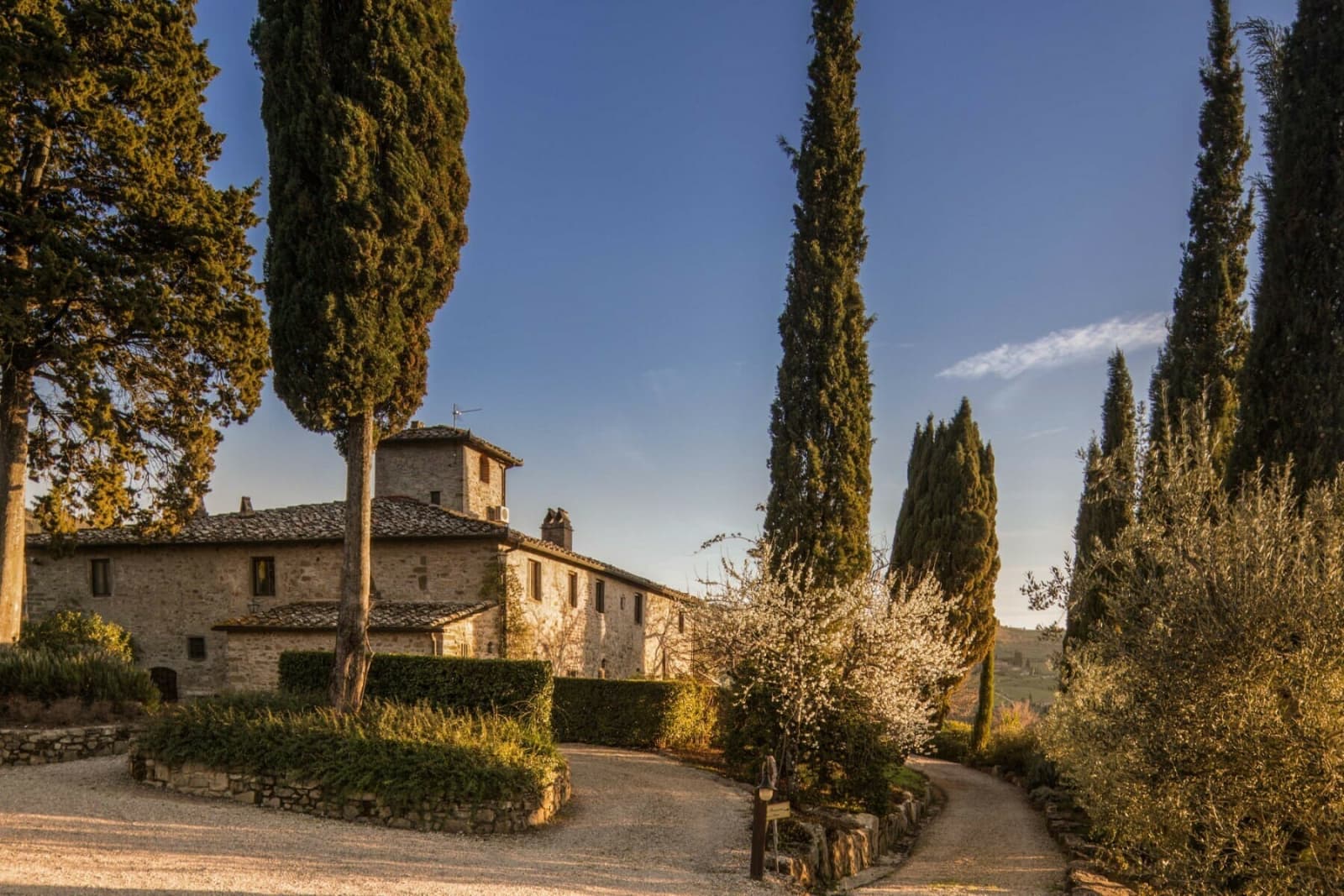 Casale Gherardi — the stone farmhouse and cypress-lined drive