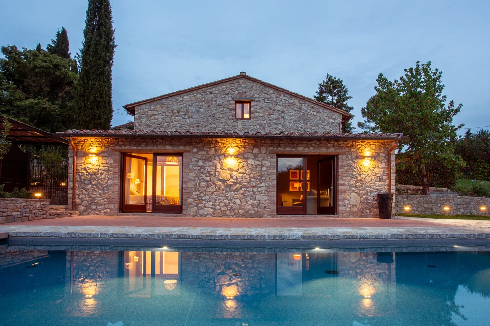 Casa Pernicella — the house lit up above the pool
