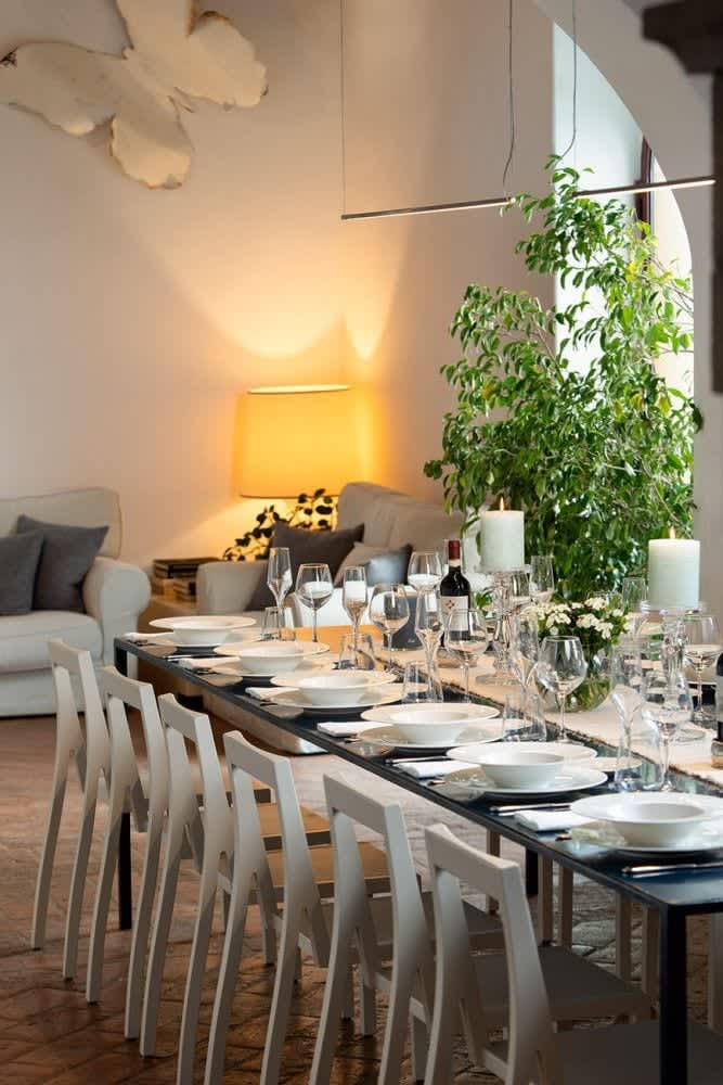 Villa Castellaro — the dining table laid by lamplight