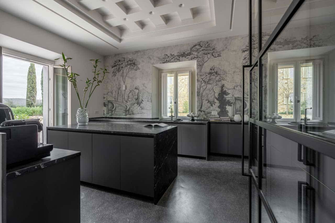 Tenuta Belvedere Estate: Tenuta Belvedere — the villa kitchen, with a hand-painted mural wall