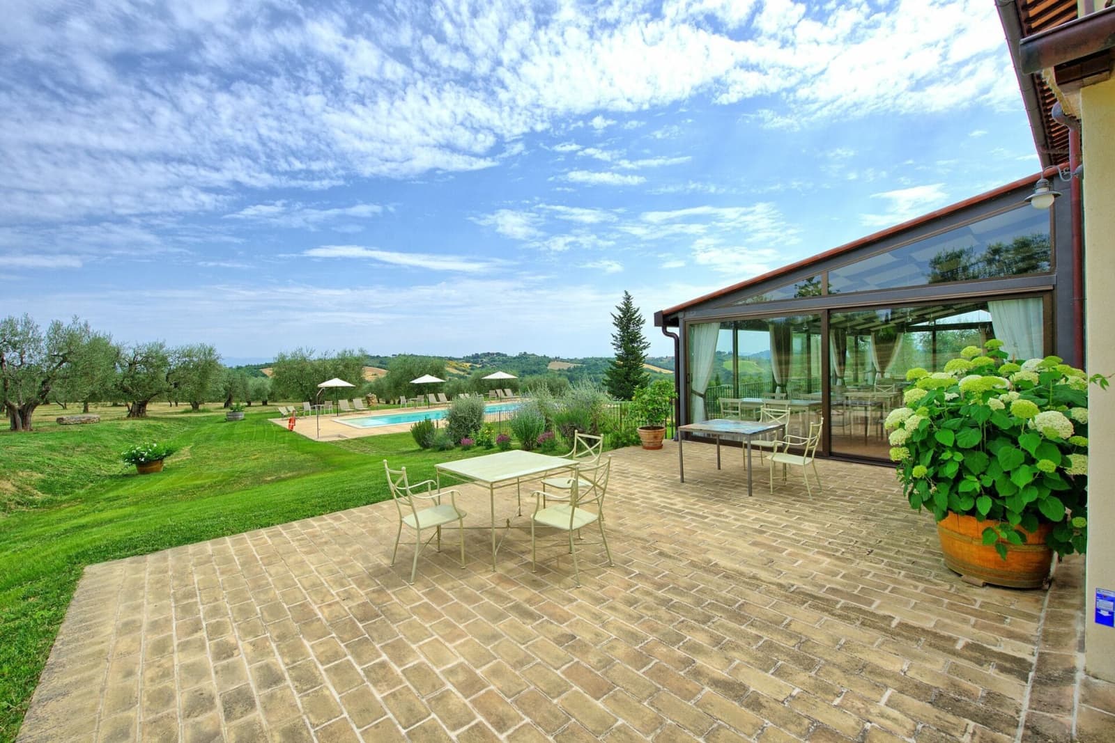Tenuta La Barricaia — the garden terrace beside the glass veranda