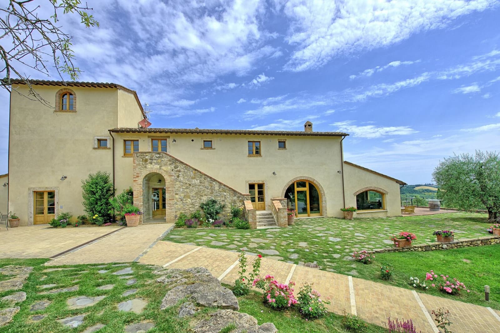 Tenuta La Barricaia — the villa's stone façade across the lawn