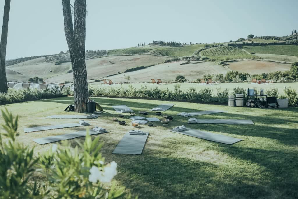 Tenuta Belvedere Estate: Tenuta Belvedere — yoga mats on the lawn above the hills