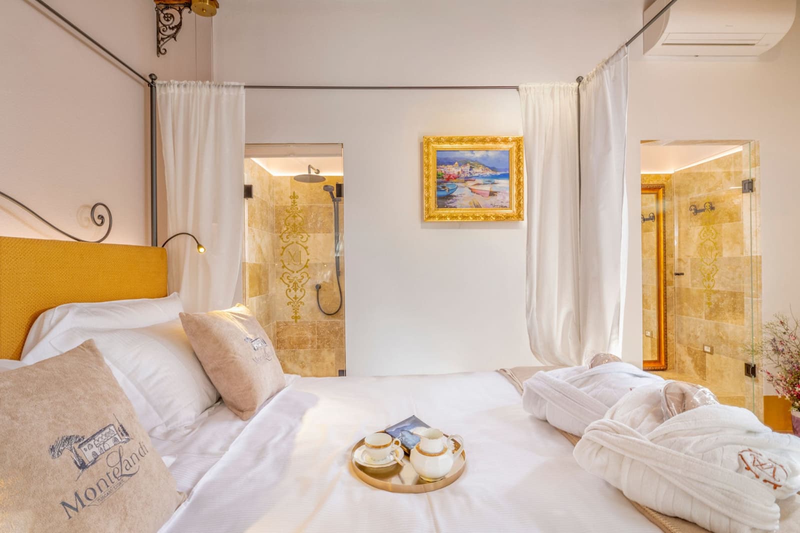 Villa Poggio d'Oro — a deluxe room with its en-suite beyond