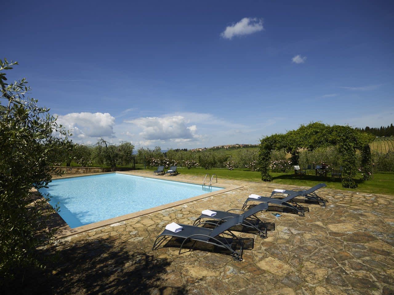 Villa Castellaro — loungers along the pool