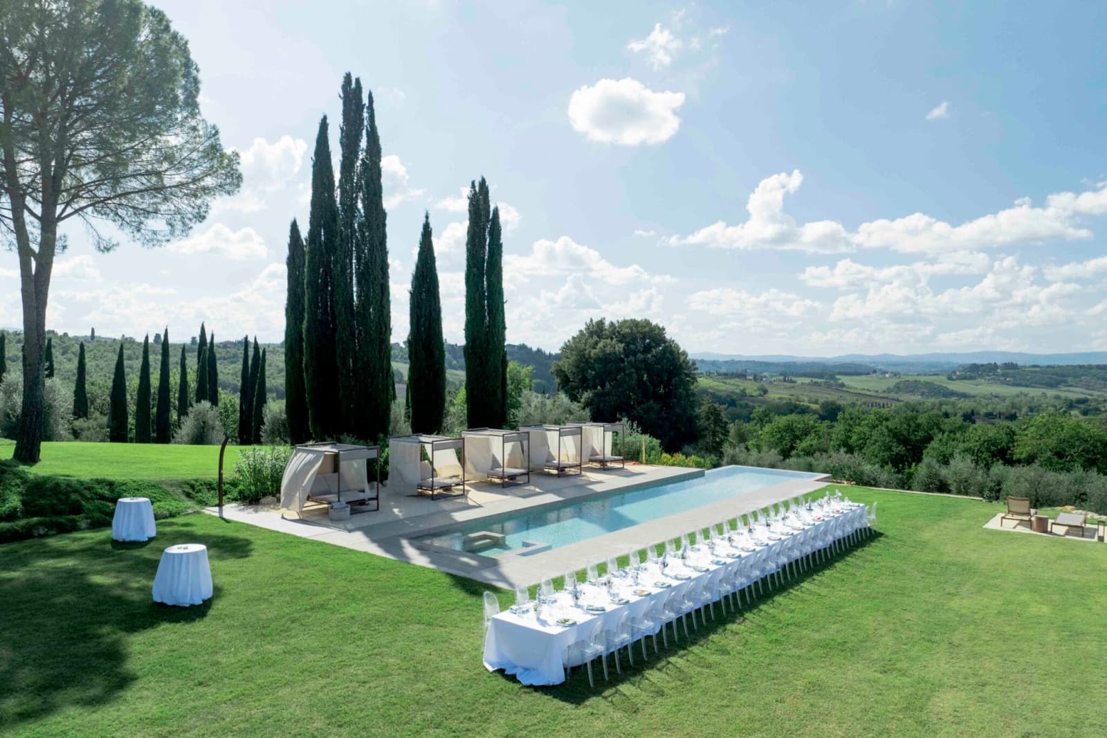 Tenuta Belvedere Estate: Tenuta Belvedere — a long table laid beside the pool