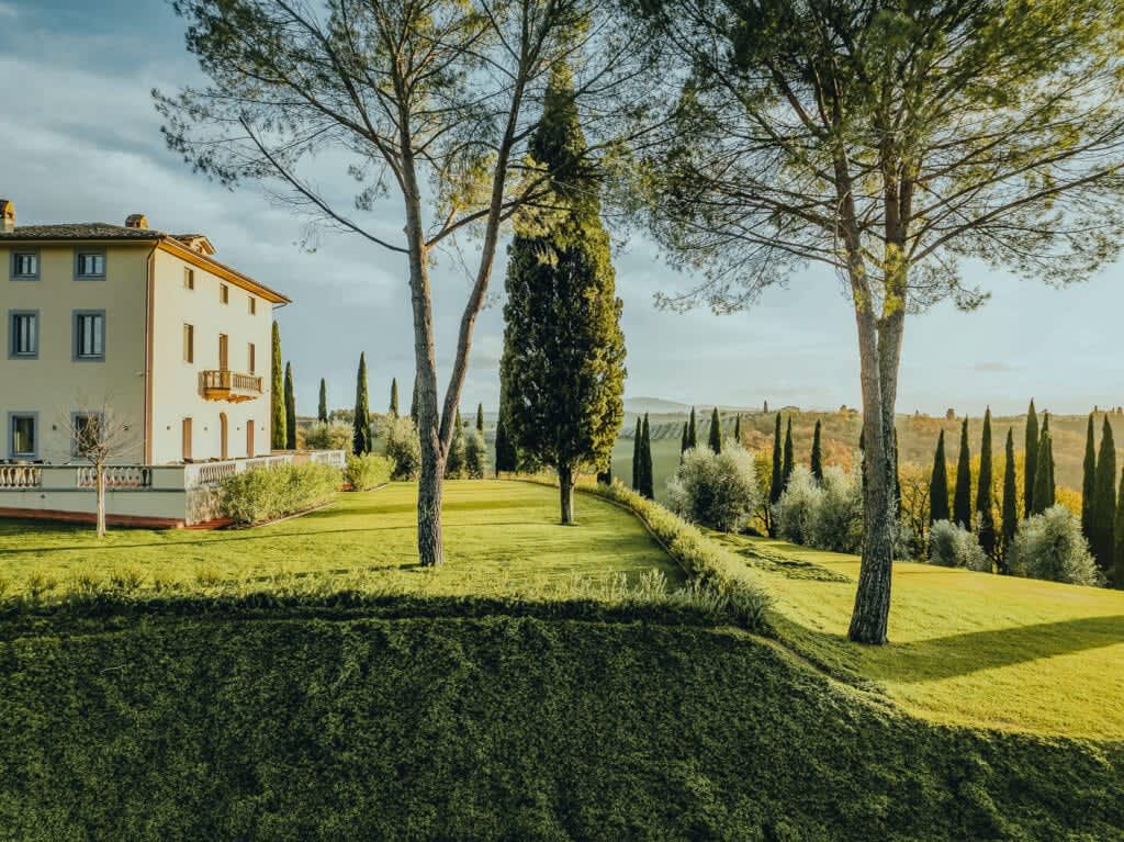 Tenuta Belvedere Estate: Tenuta Belvedere — cypresses along the lawn