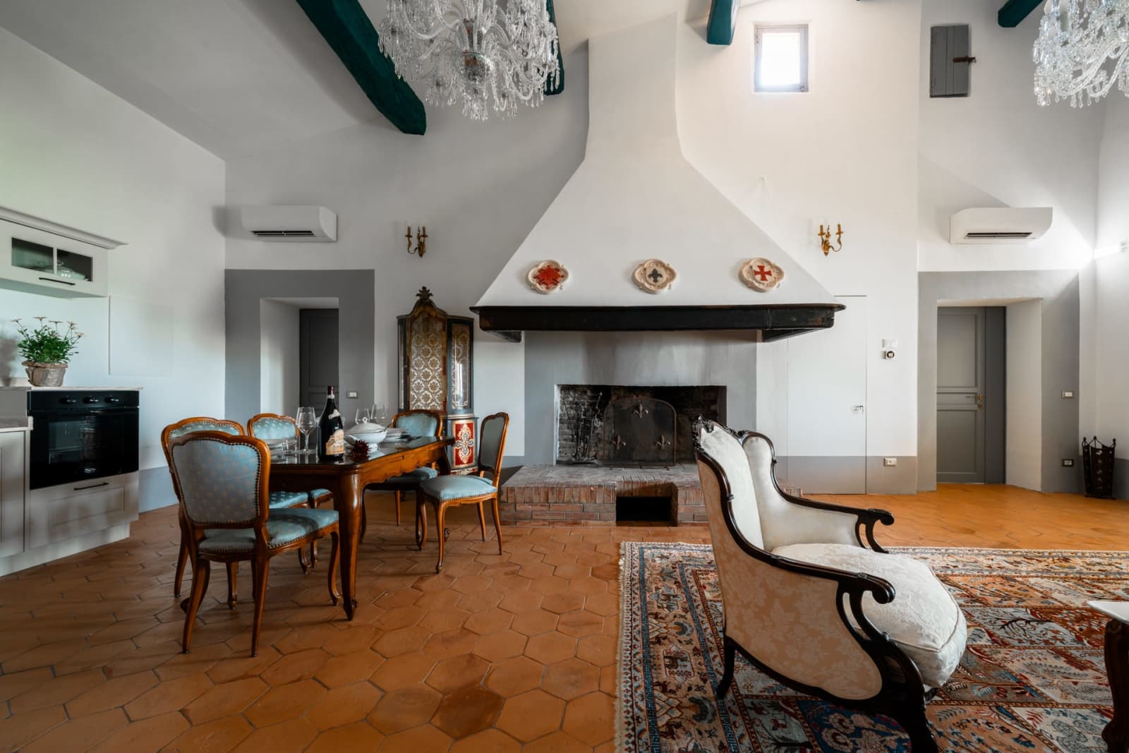 Villa Poggio d'Oro — the lounge, with its fireplace and dining table