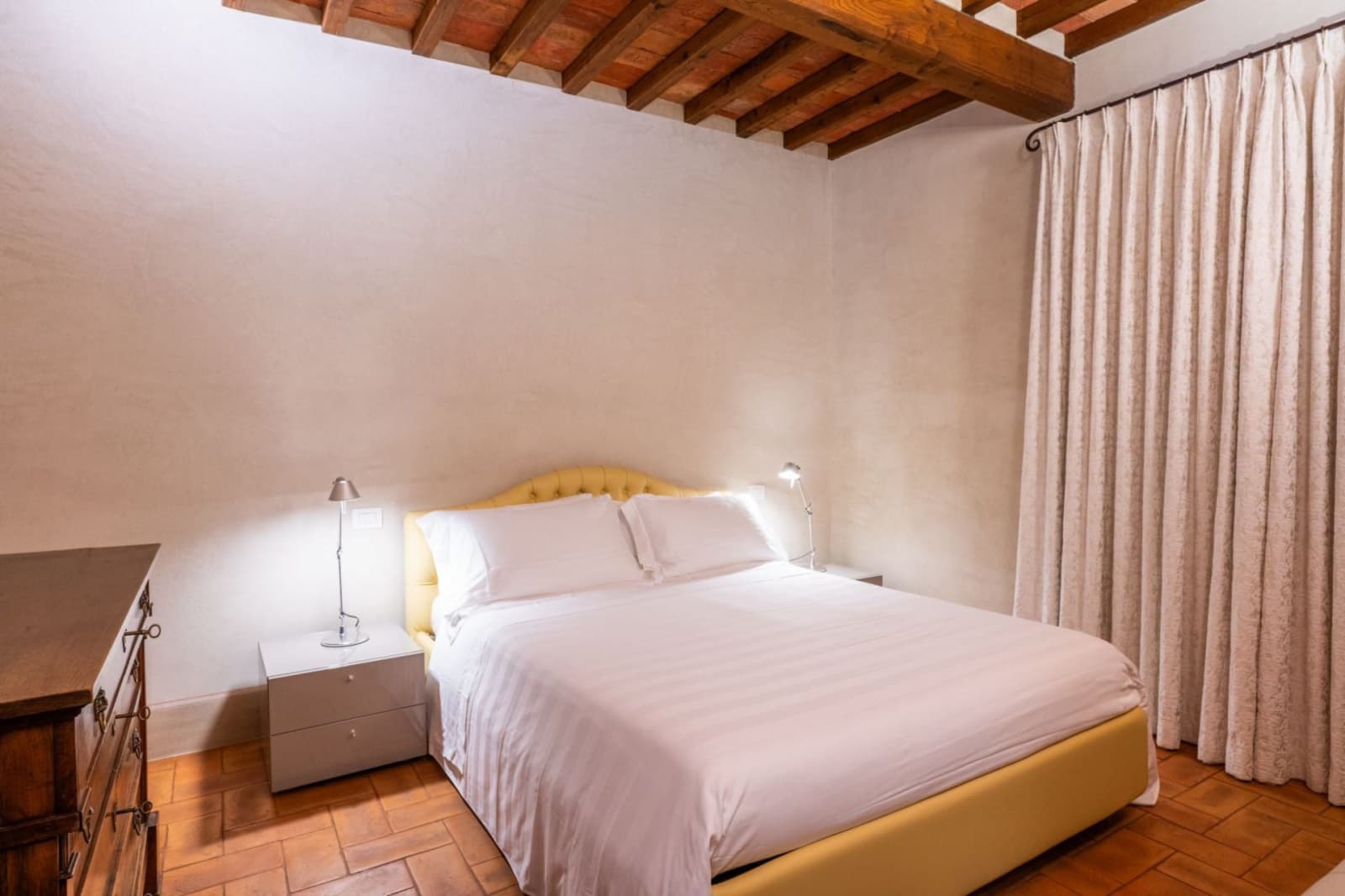 Villa San Bartolomeo — a twin bedroom with wrought-iron beds