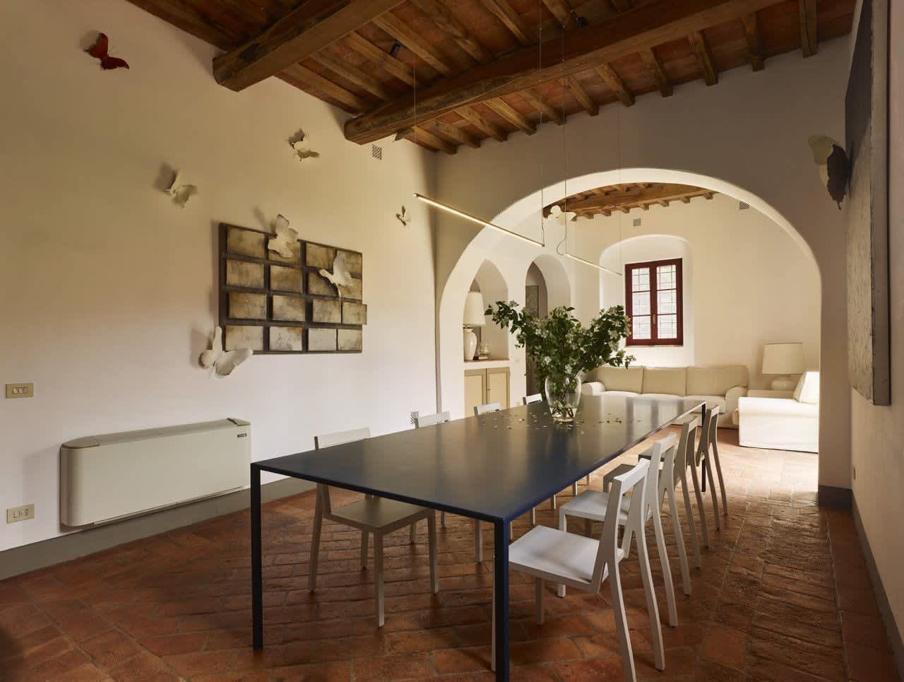 Villa Castellaro — a dining corner beneath an arch
