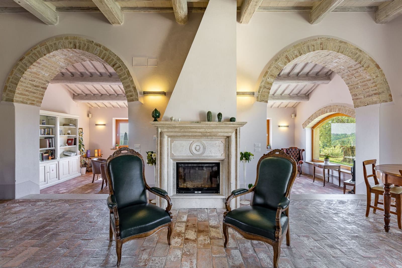 Tenuta La Barricaia — armchairs beside the fireplace