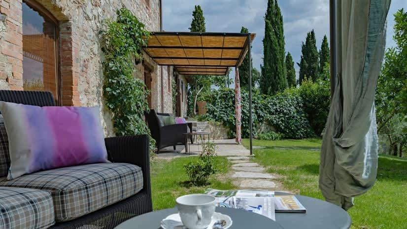 Borgo delle Vigne — the covered pergola terrace, with outdoor seating