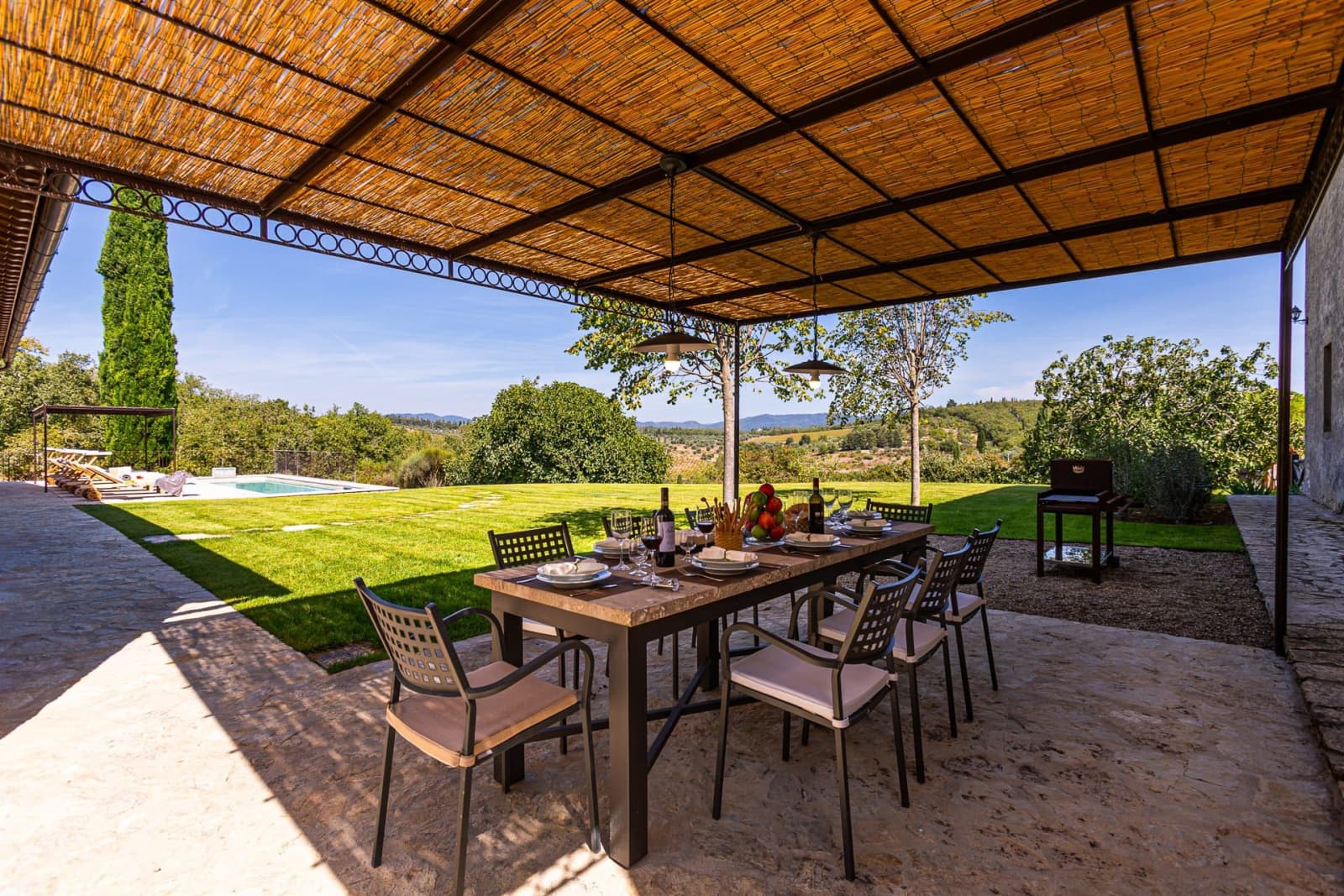 Casa Faraonia — the pergola dining table on the lawn