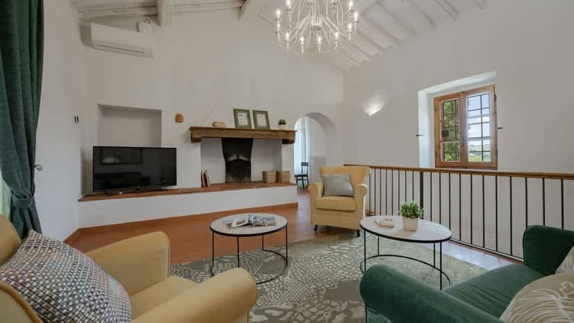 Borgo delle Vigne — a mezzanine sitting room, overlooking the entrance hall below