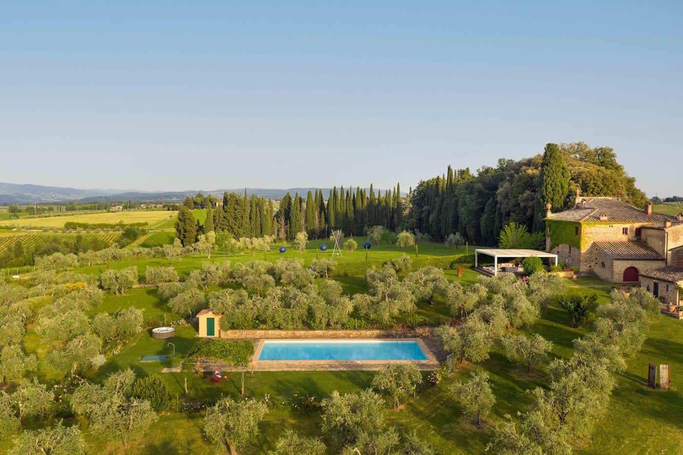 Villa Castellaro — the pool and olive groves in the evening light
