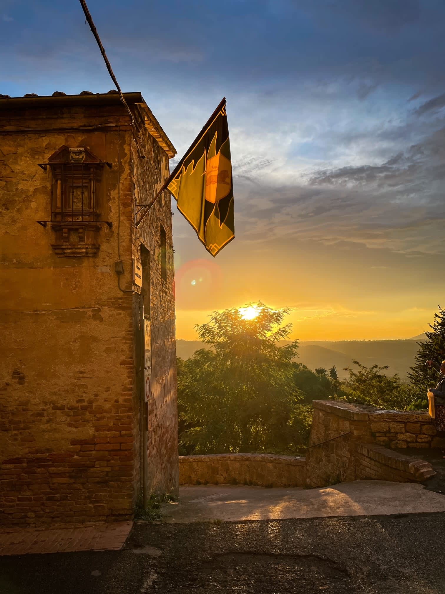Villa Poggio d'Oro — sunset beside the villa's old walls