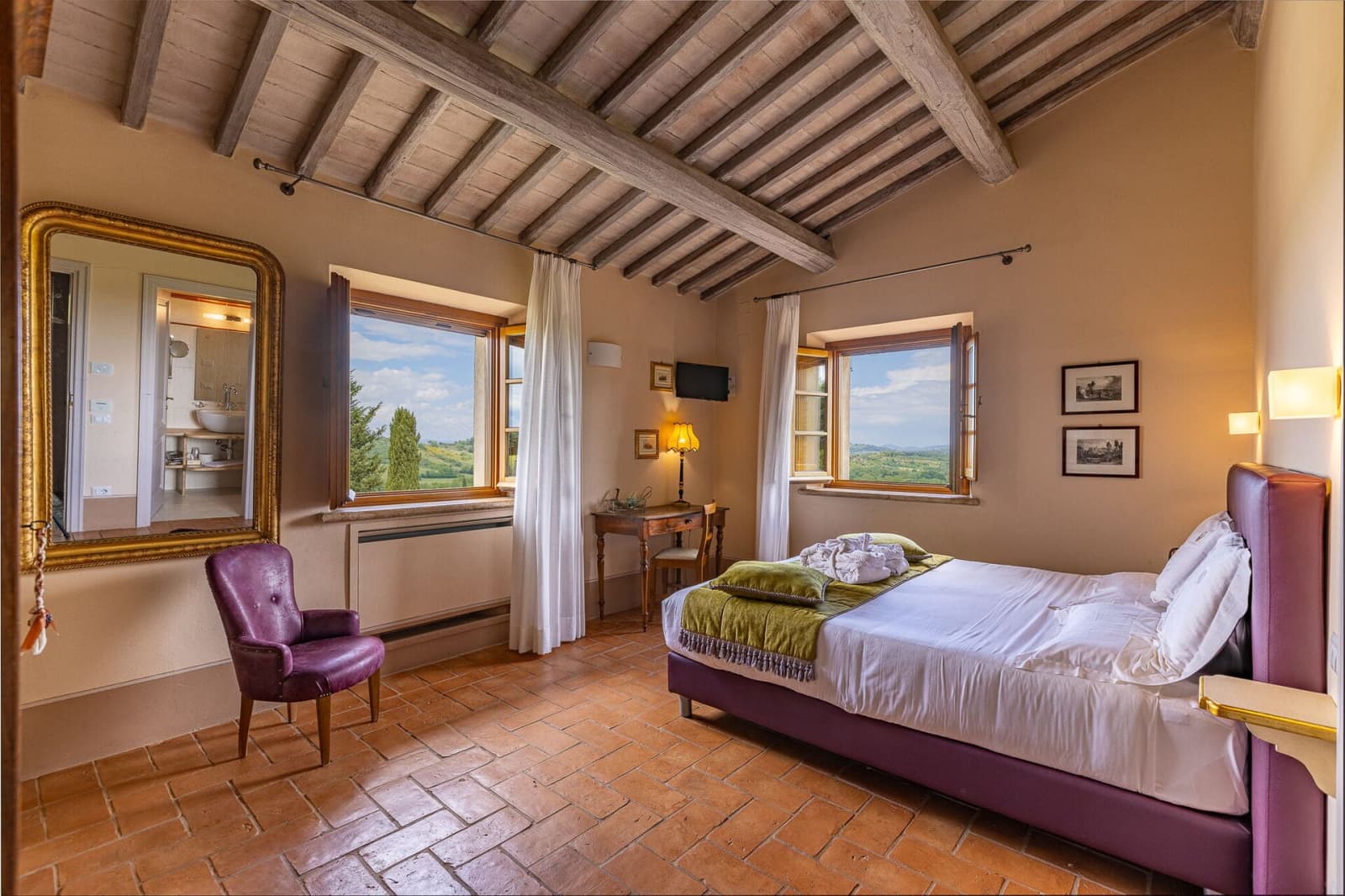 Tenuta La Barricaia — a double bedroom under exposed beams