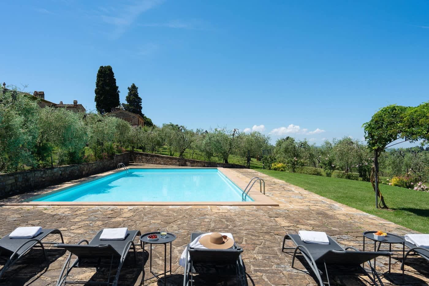 Villa Castellaro — the pool edged by olive trees