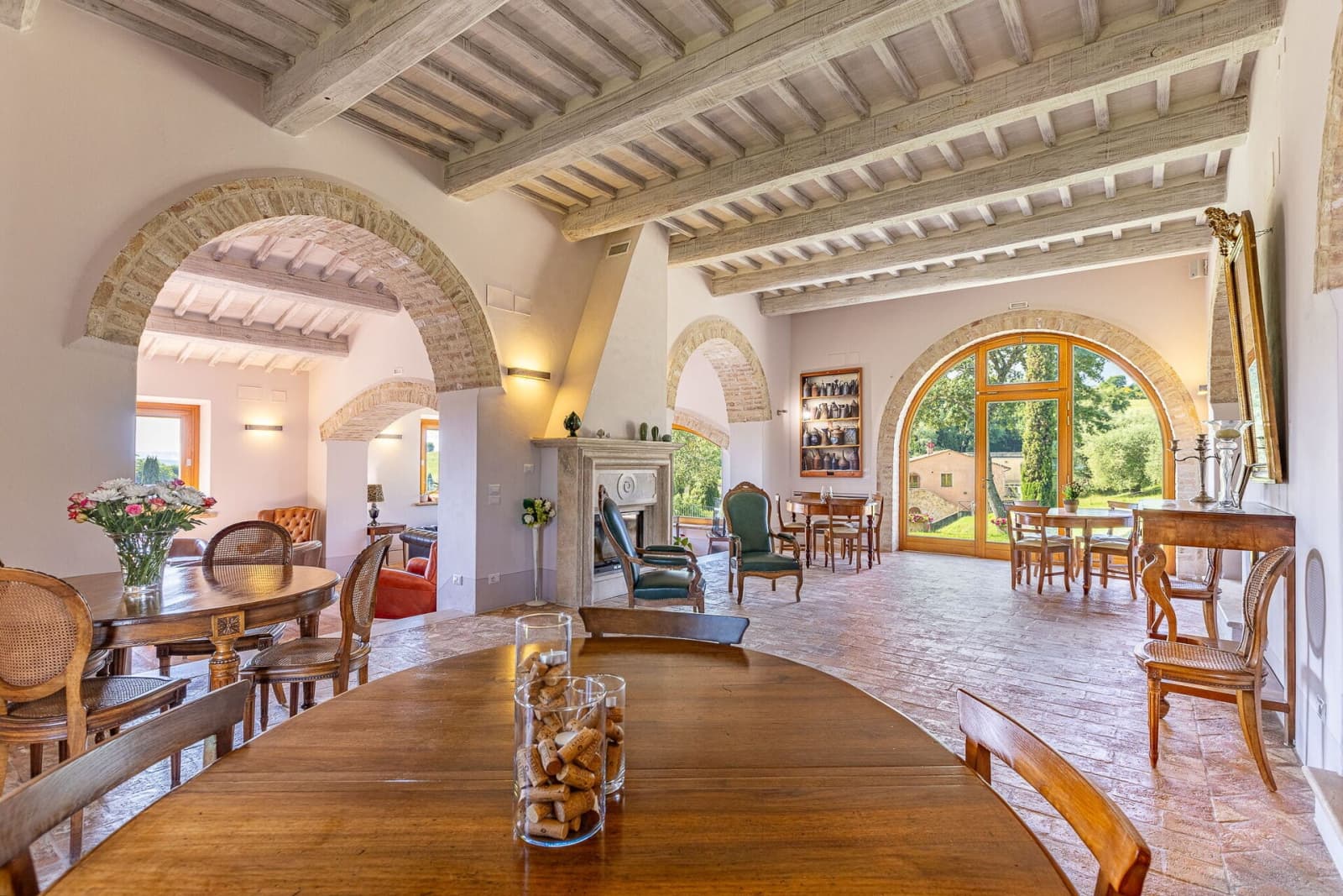 Tenuta La Barricaia — the three-level living room beneath beamed ceilings