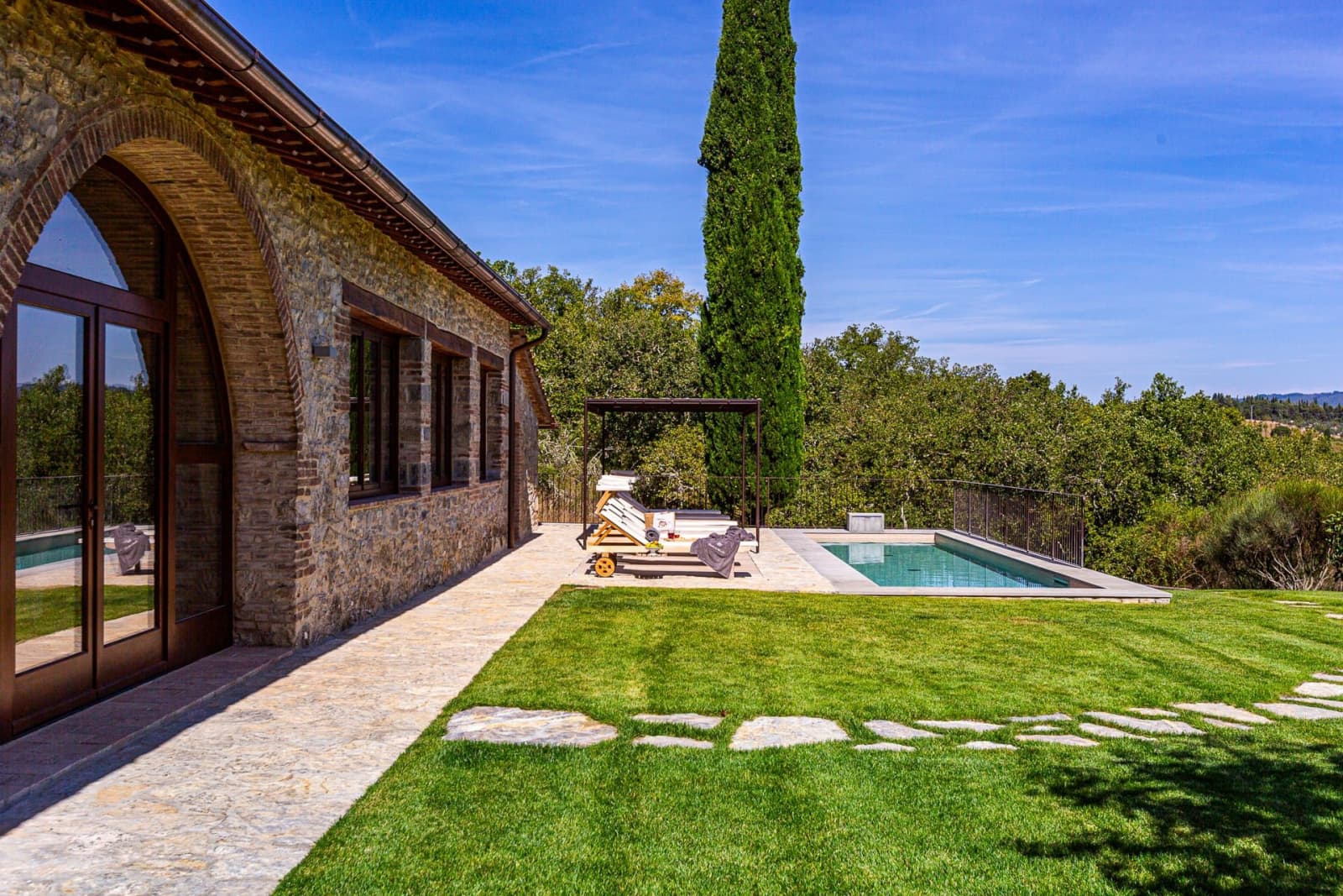 Casa Faraonia — the stone house, lawn and pool