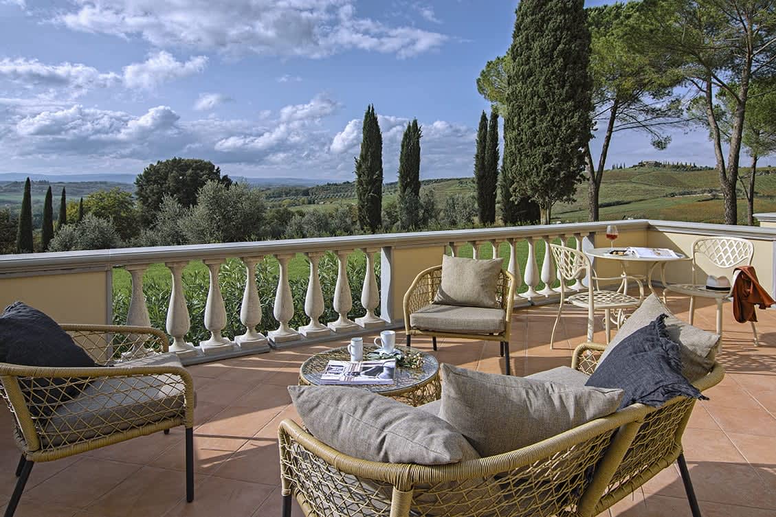 Tenuta Belvedere Estate: Tenuta Belvedere — a terrace with armchairs over the view