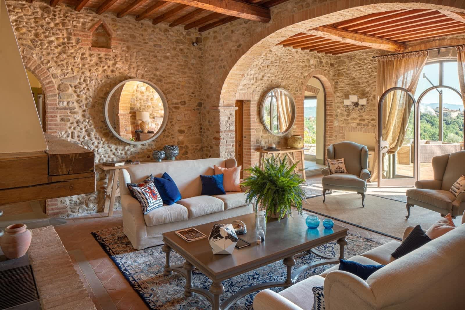 Solare del Chianti — the stone hall with its arches and fireplace