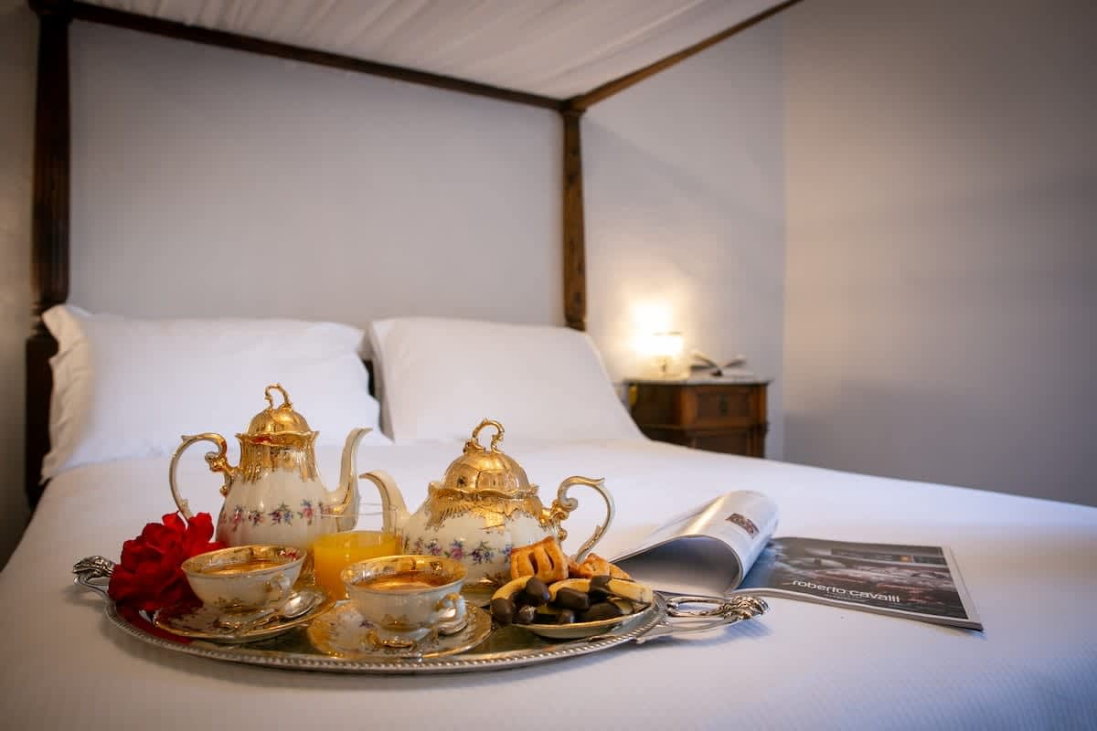 Villa della Cappella — a bedroom armchair with a tea tray