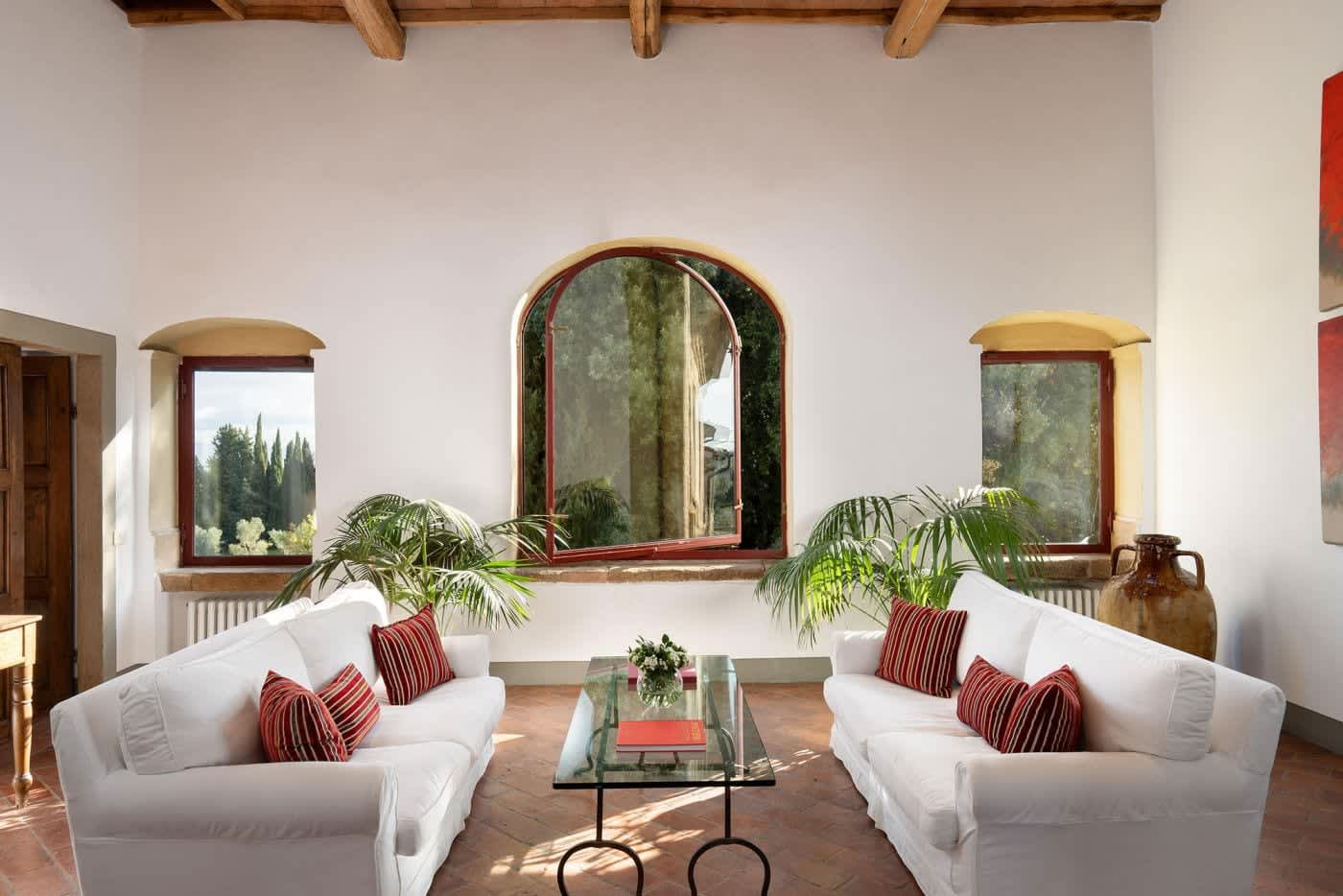 Villa Castellaro — white sofas around a glass table
