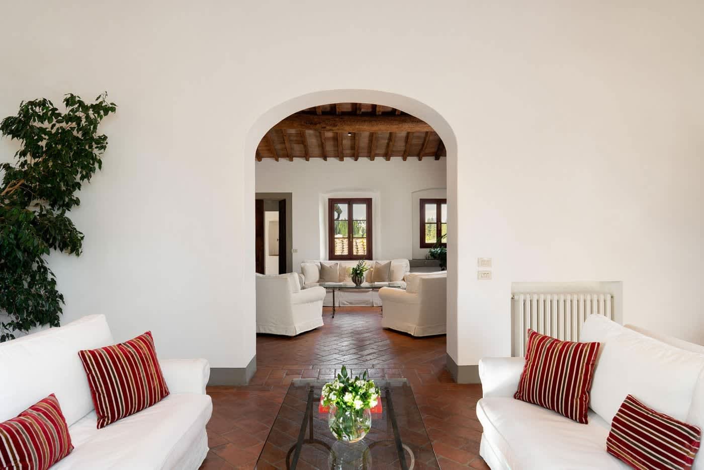 Villa Castellaro — the living room through an arched doorway