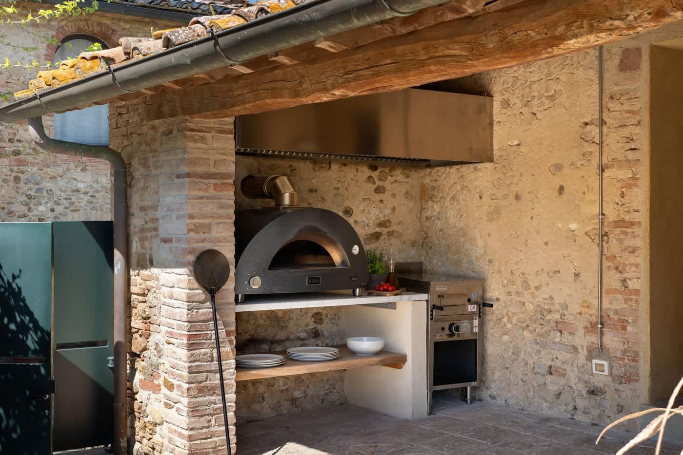 Villa Castellaro — the wood-fired pizza oven in the outdoor kitchen