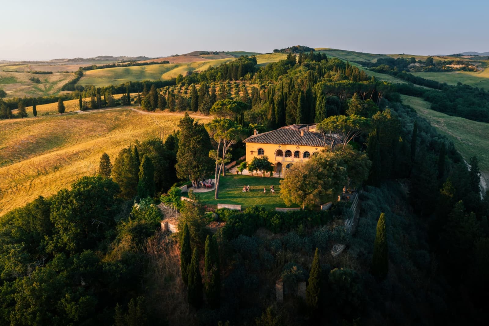 Villa Poggio d'Oro — the villa on its hilltop at golden hour, from above