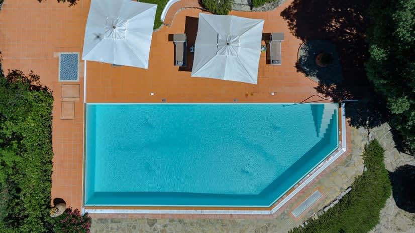 Borgo delle Vigne — a directly-overhead view of the pool and terrace