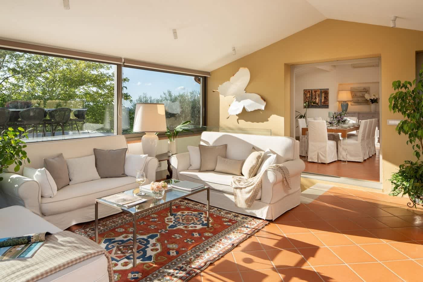 Casa Lilia — the living room with its window onto the olive trees