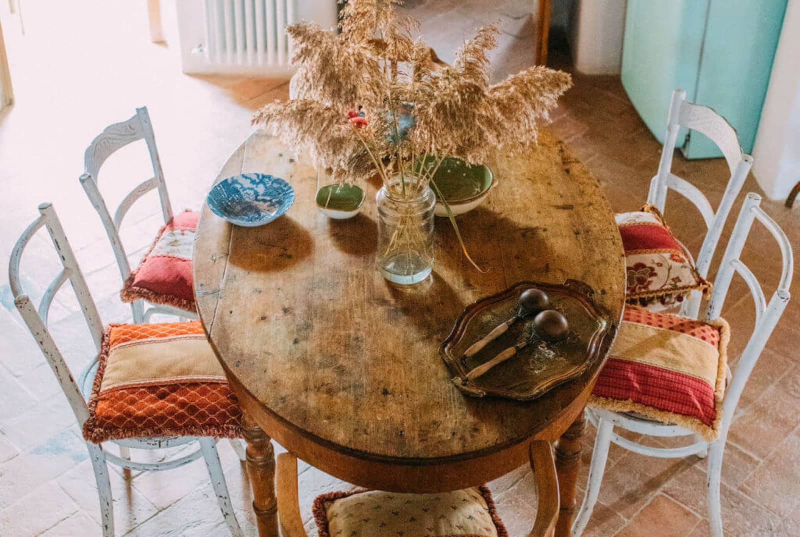 Villa delle Sorelle — a round table set in the second kitchen