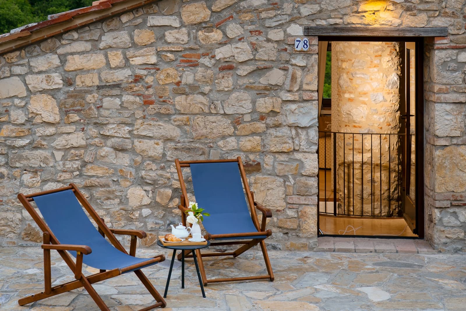 Casa Pernicella — a deckchair against the stone wall