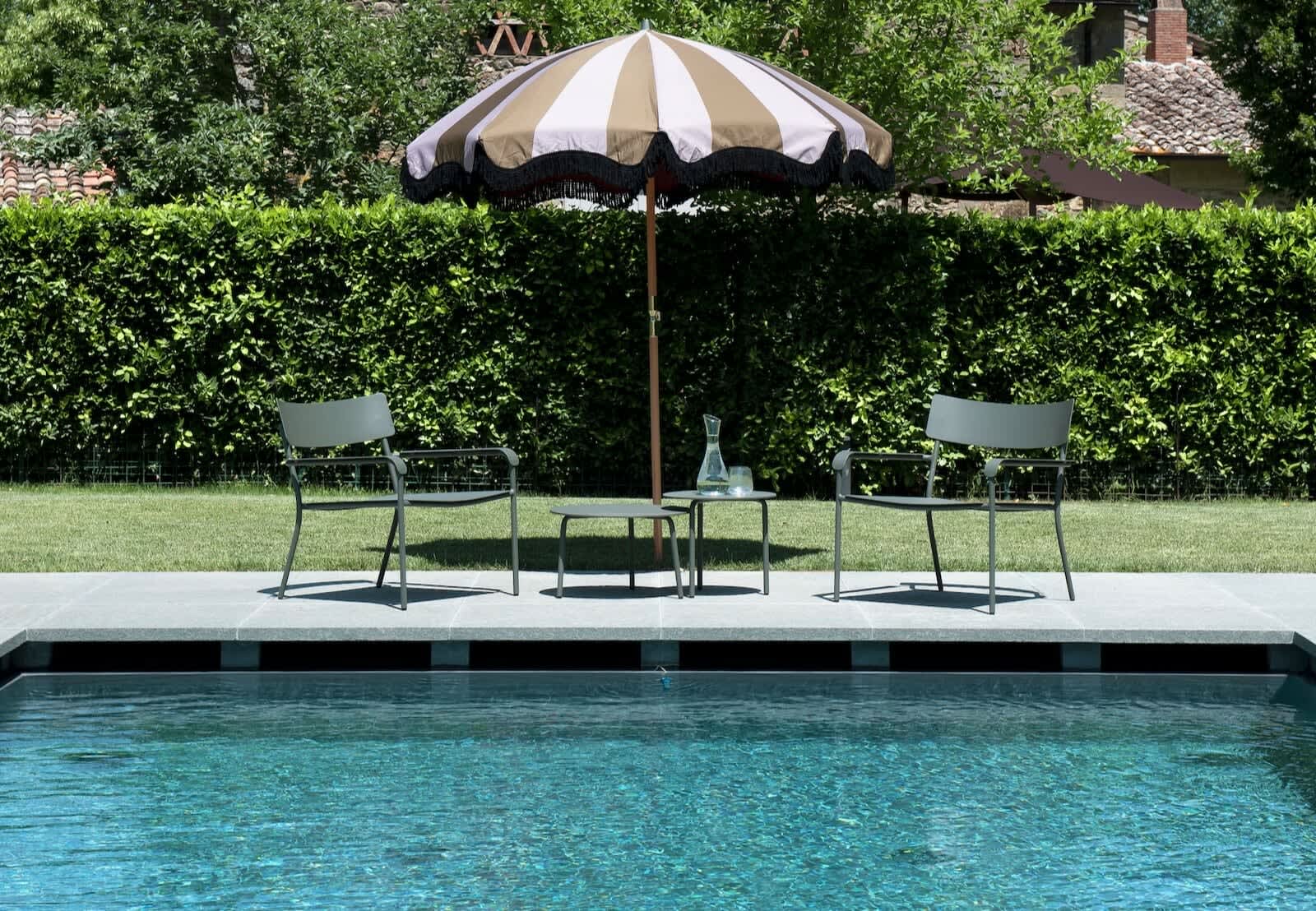 Villa Erbavoglio — poolside loungers and umbrella